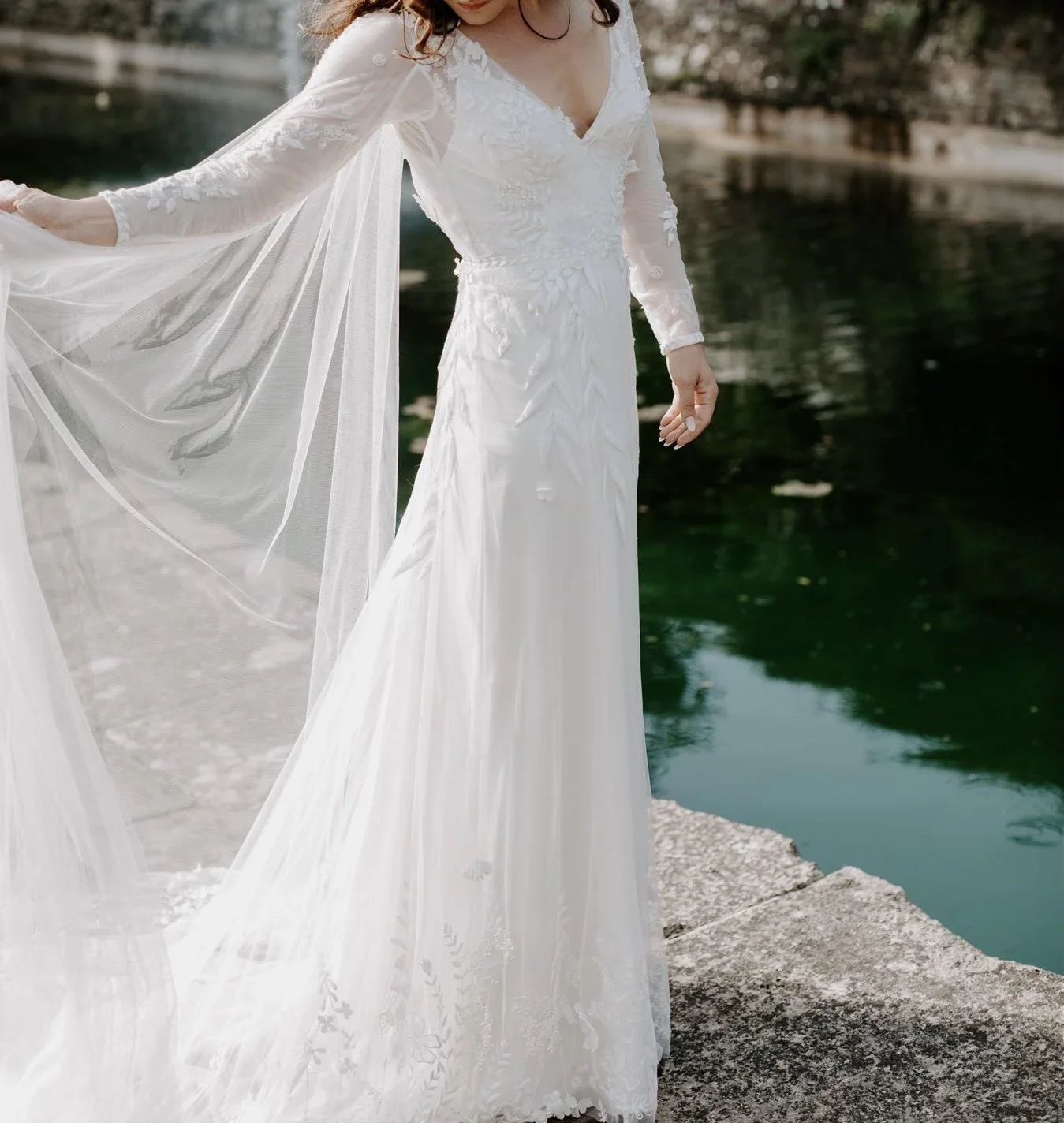 bespoke wedding dress embroidered with french wild flowers and swarovski pearls.