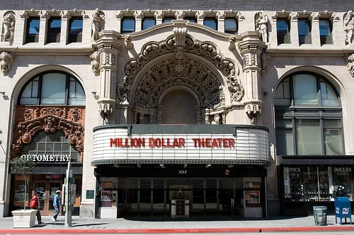 THE MILLION DOLLAR THEATRE Sid Grauman's first major theatre was named Grauman's Theatre when it opened on February 1, 1918 with William S. Hart in "The Silent Man." Following the hype over its price tag it soon became known as Grauman's Million Dollar Theatre, although it was not officially named this until 1922. The auditorium was built behind the twelve story Edison office building; the exterior is a magnificent example of a variation of Spanish Rococo style known as Churrigueresque... R EAD MORE