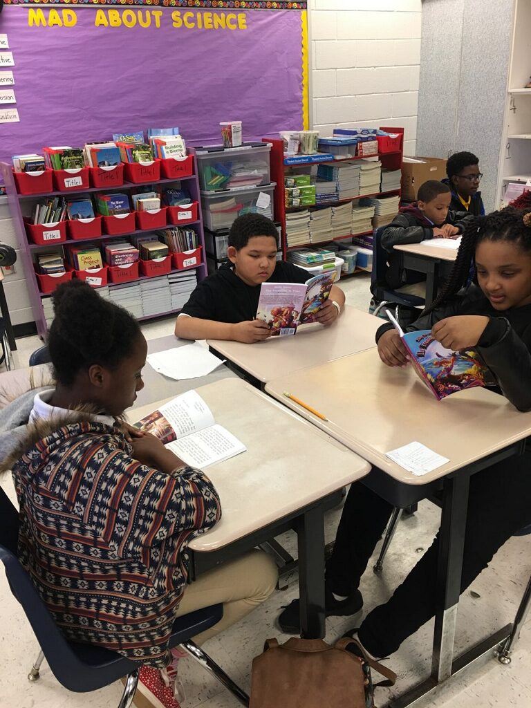 CHILDREN READING SALLY SAVER BY DL COLLINS.jpeg