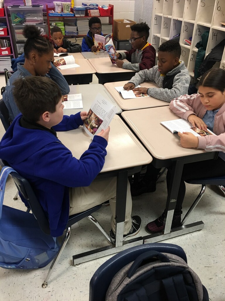 CHILDREN READING SALLY SAVER.jpeg