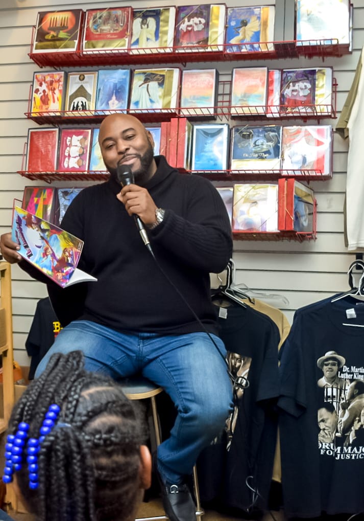 DL COLLINS READING TO THE CHILDREN.jpeg