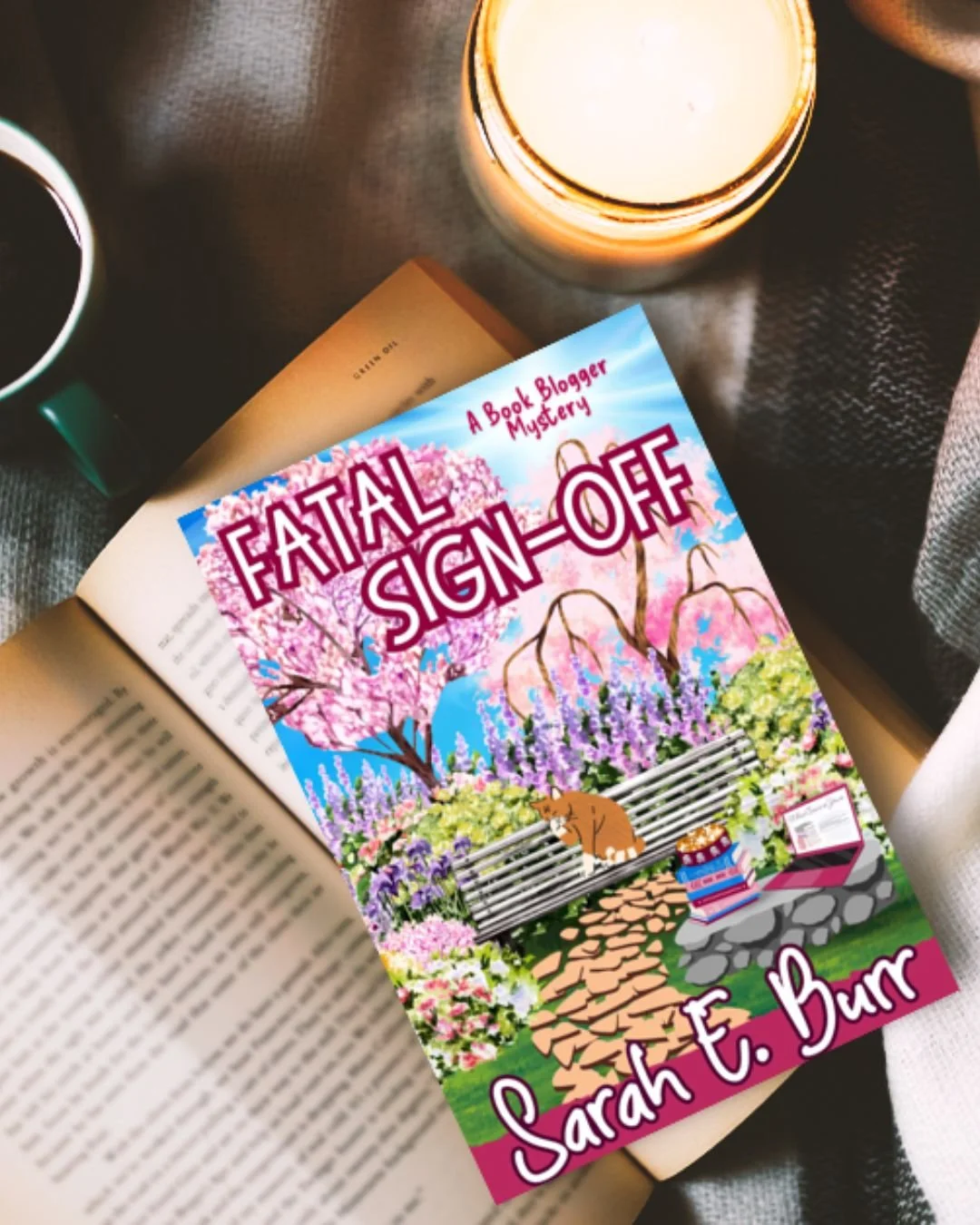 Cozy setup check: drink, candle, blanket
and a mystery waiting to happen. 

If you love bookish sleuthing with a blogger twist, Fatal Sign-Off is calling your name. 

Tell me your cozy reading essential: 
A) Coffee/tea 
B) Candle 
C) Blanket 
D) Snac