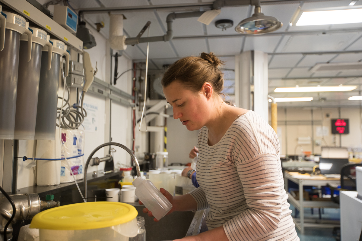 Caitlin Smoot in the late evening working hard to finish processing the zooplankton sample at the first sampling station. Photo credit: Brendan Smith