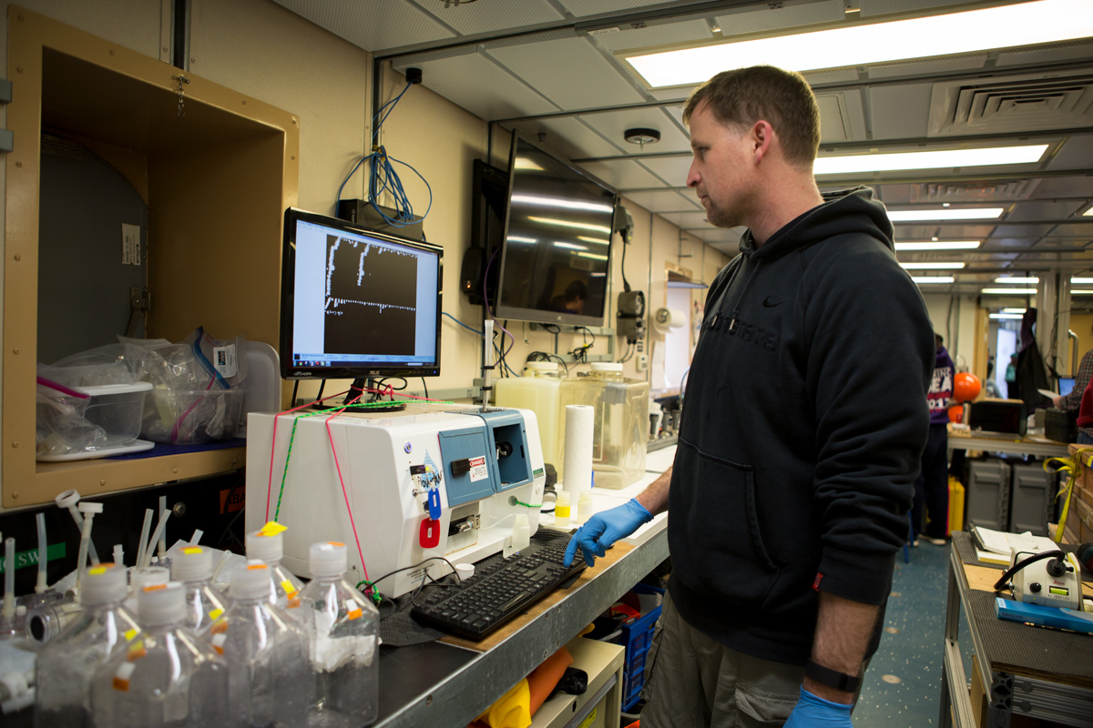 Scientist Jeff Krause describing the process of filtration through the FloCam instrument, an incredible tool used to visualize even the smallest of microplankton in the water column. Photo credit: Brendan Smith