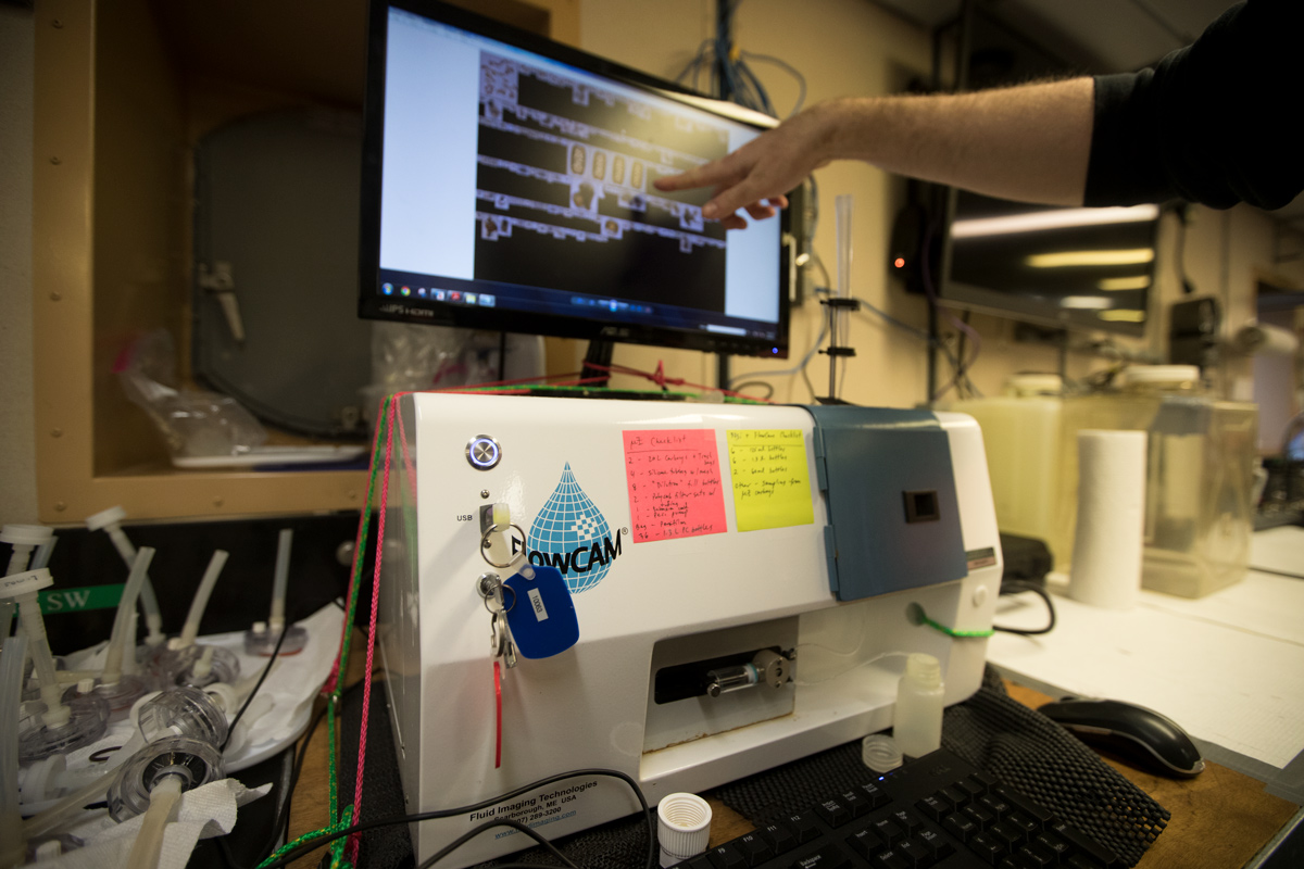 Scientist Jeff Krause describing the process of filtration through the FloCam instrument, an incredible tool used to visualize even the smallest of microplankton in the water column.Photo credit: Brendan Smith