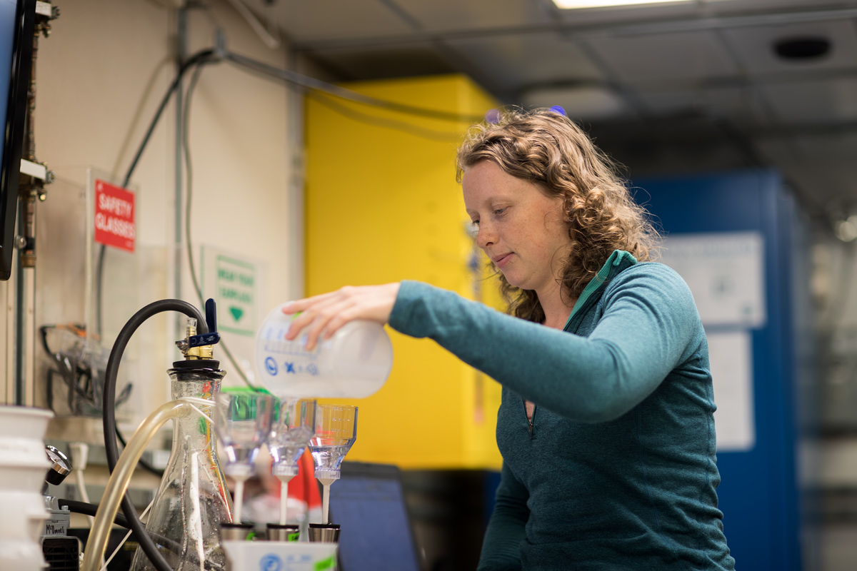 Filtering water samples for suspended particulate matter. Photo credit: Brendan Smith