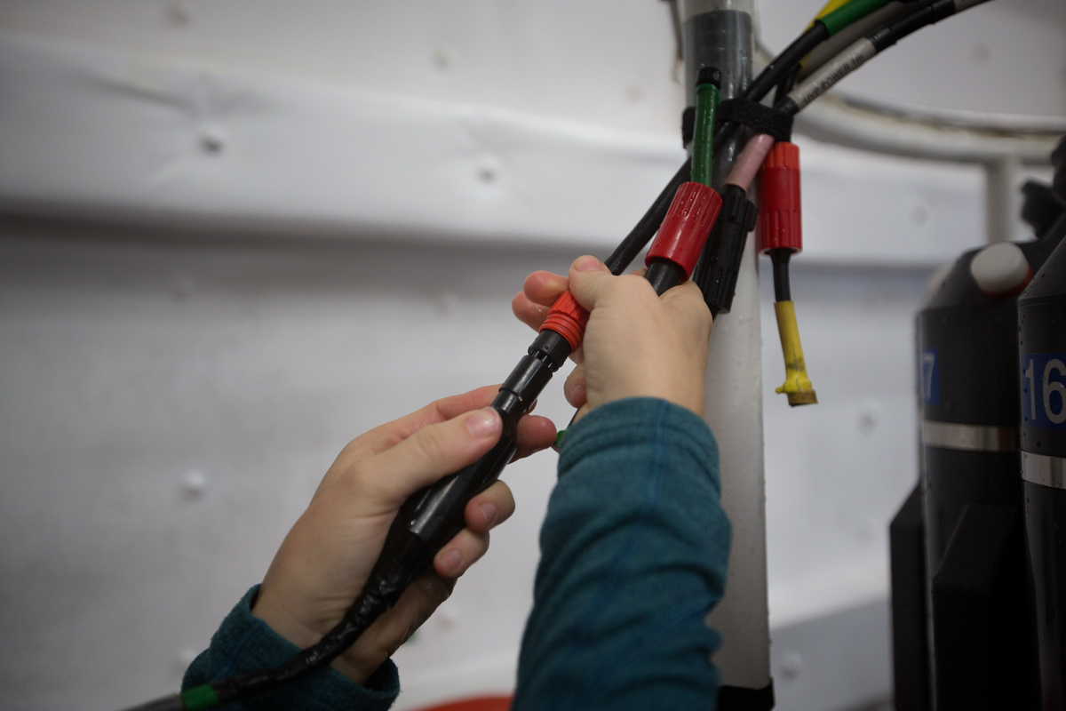 Hooking up the Underwater Vision Profiler (UVP) connectors. Photo credit: Brendan Smith