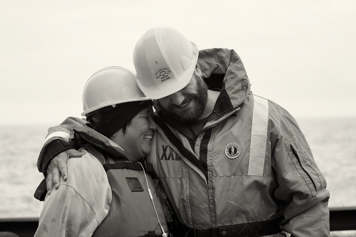 Photographer Brendan Smith and Opik hug after an amphipod eating contest. Photo credit: Jessica Pretty