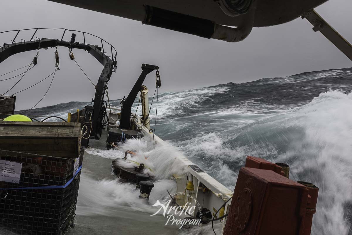 Waves wash the deck as the R/V Ocean Starr heads north through the Bering Sea. Photo credit: Brendan Smith/NPRB