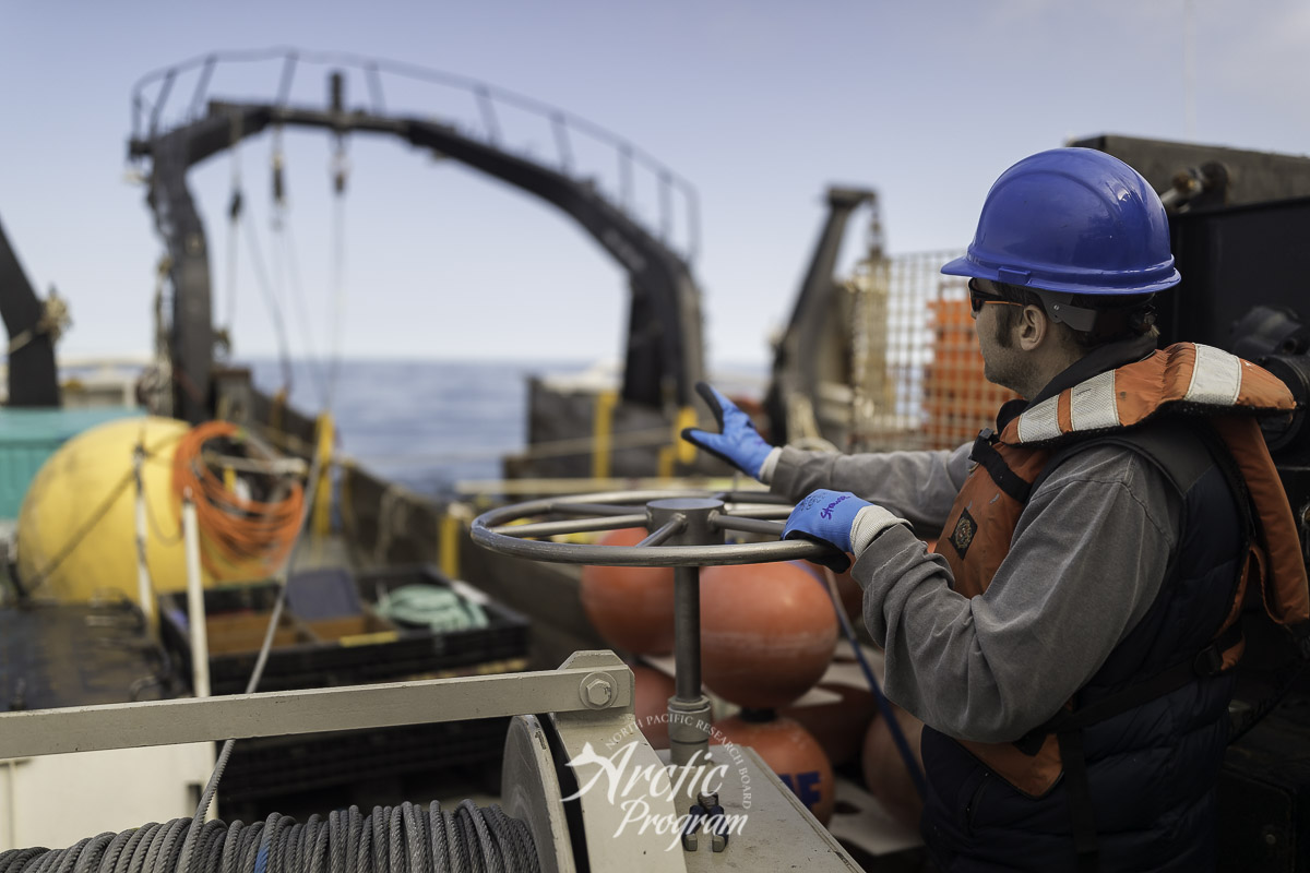 Scientist Dave Strauss guiding the dragging wire for a missing mooring buoy. Photo credit: Brendan Smith/NPRB
