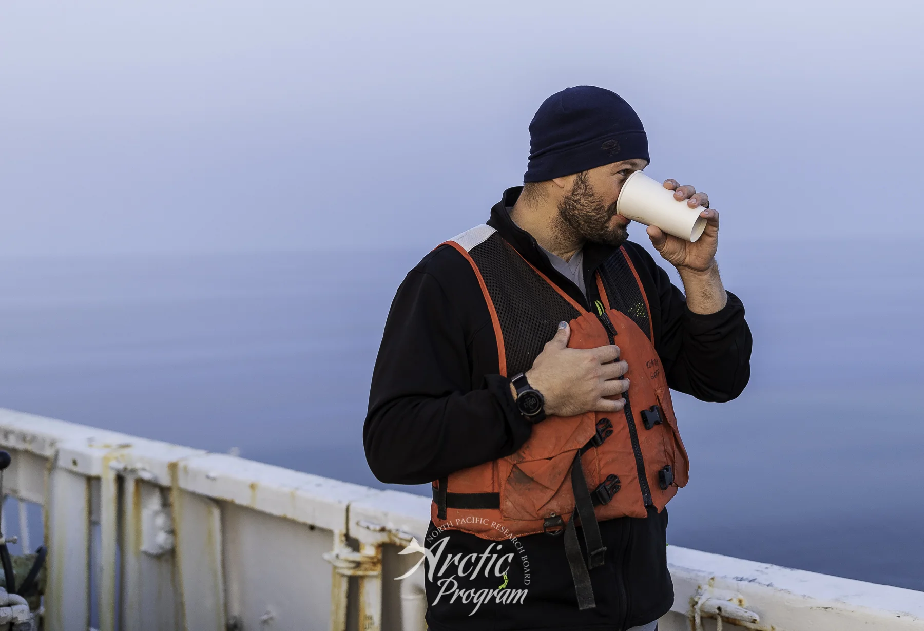Sunrise (and moon set) at 0500 on the back deck of R/V Ocean Starr . Photograph by Sarah Donohoe of author.
