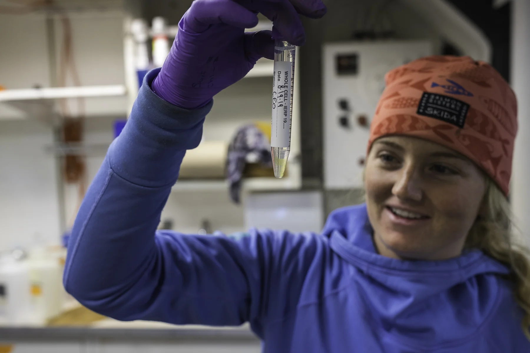 Anna shows off some sample collected from surface water at an expected plankton bloom. Photo by Brendan Smith/NPRB