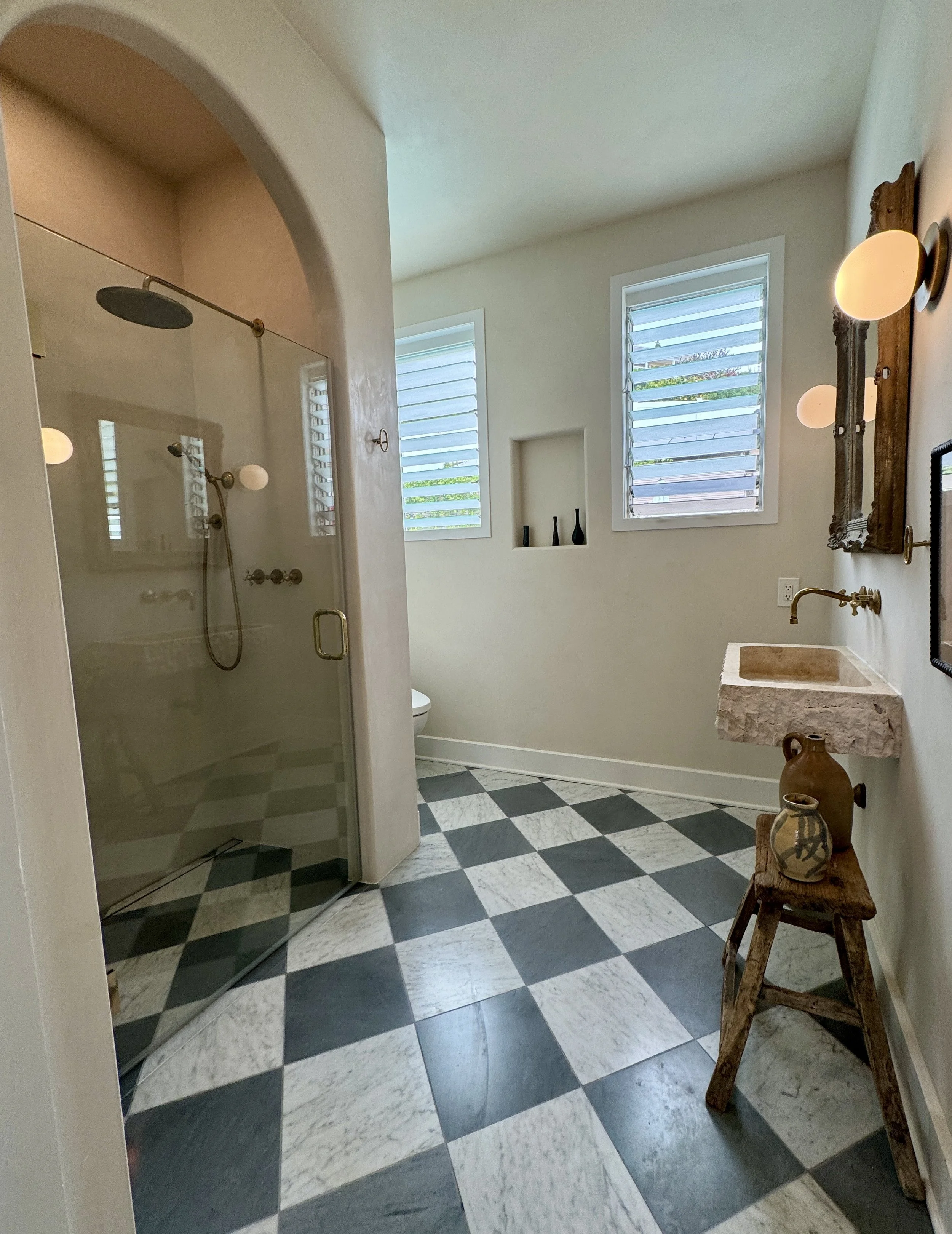 Bathroom remodel using marble tile floor and Tadelakt lime plaster shower in Waikiki