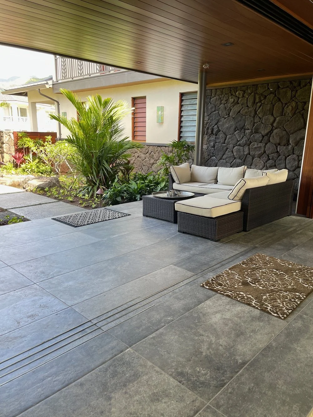 Lanai Tile Floors 
 
Lanai tile floor installation involves smoothly transitioning the interior spaces to exterior lanai areas, particularly when integrating sliding door tracks.