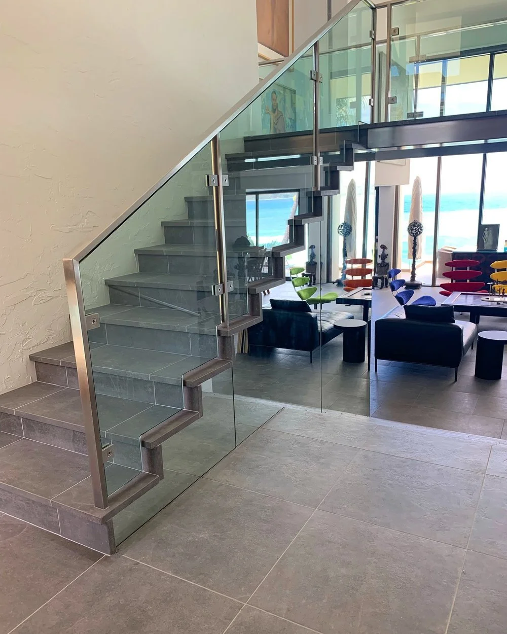 Porcelain Stairs and Floors 
 
Porcelain stairs with mitered nose installation present a sophisticated look for this home remodel in Honolulu. This technique involves precisely cutting the edges of the porcelain tiles to create a seamless transition