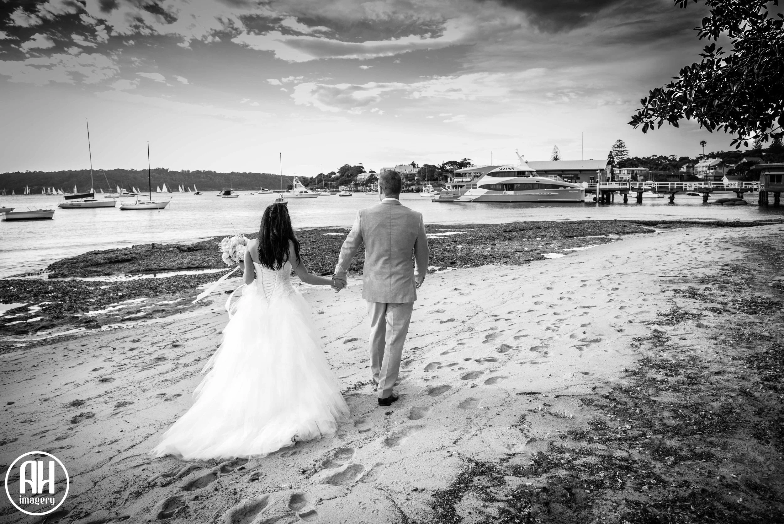 Bride and Groom Walking On The Beach