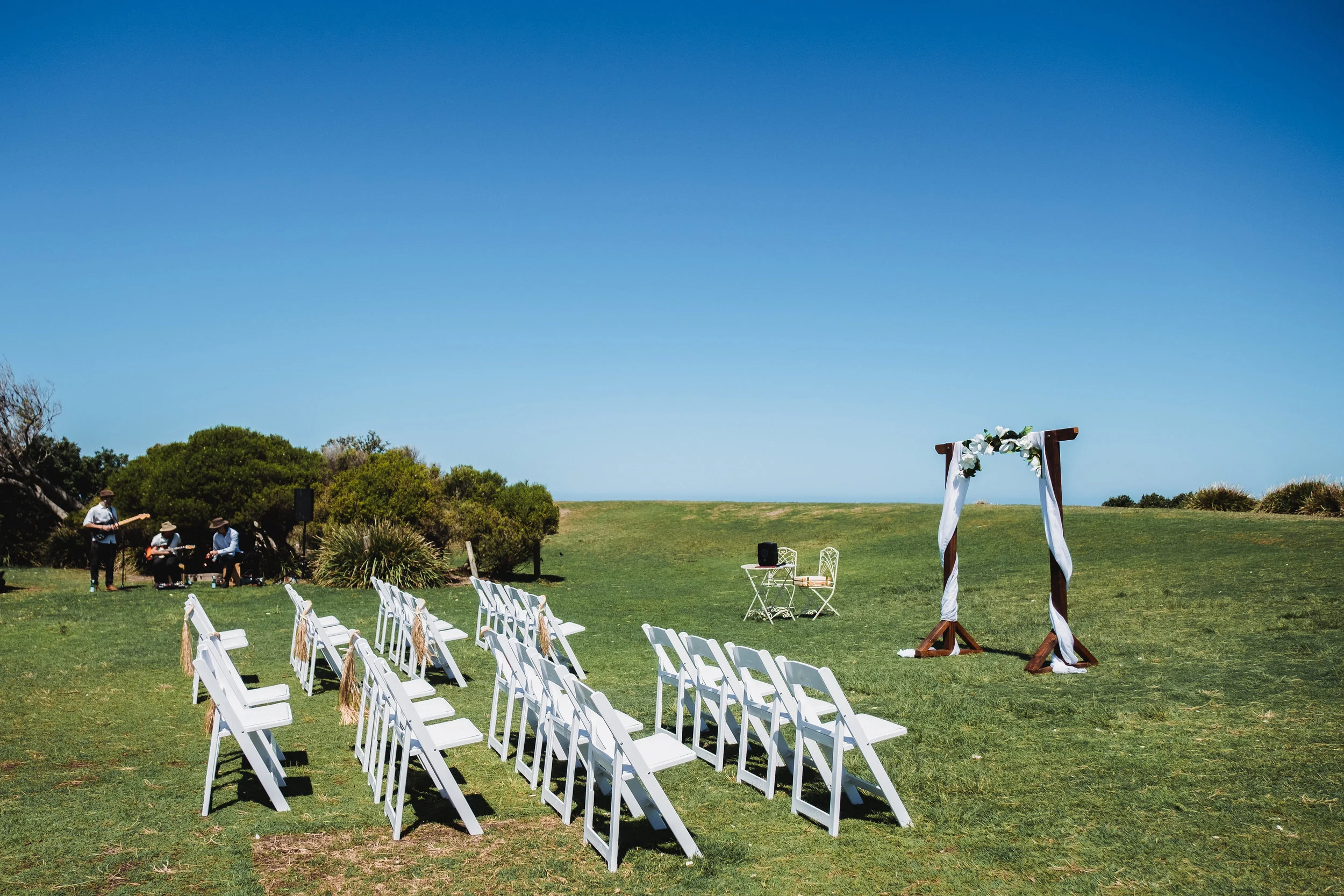Wedding Ceremony set up with white chairs at Marks Park in Bondi Beach