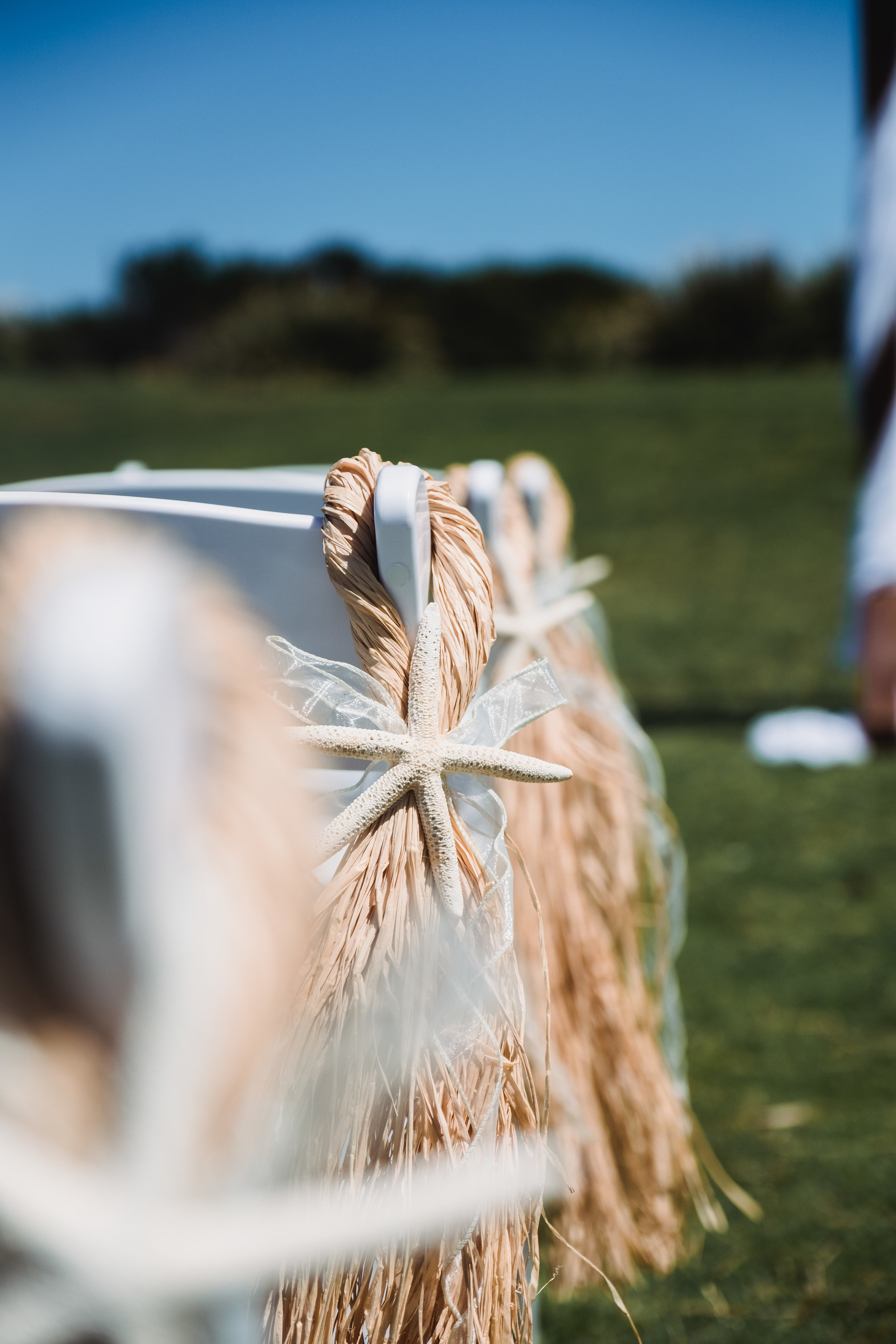 Wedding Ceremony set up with white chairs and nautical decorations at Marks Park in Bondi Beach