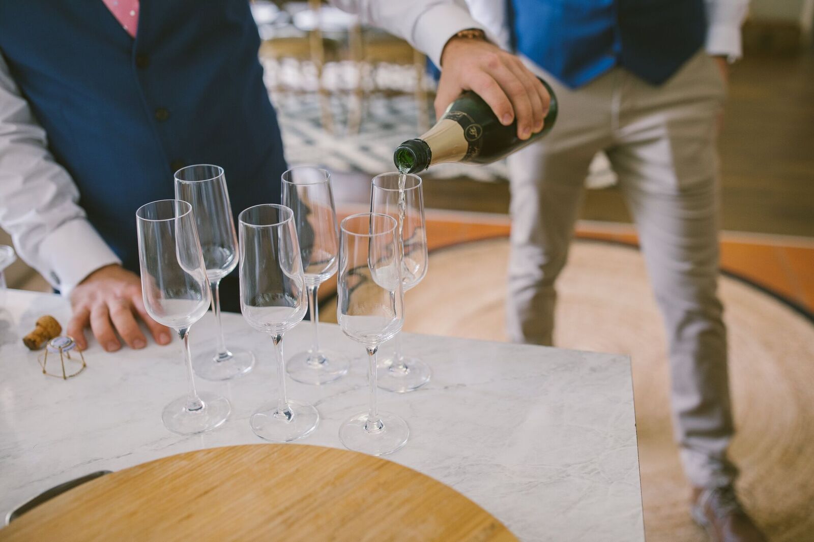 Grooms drinking champagne