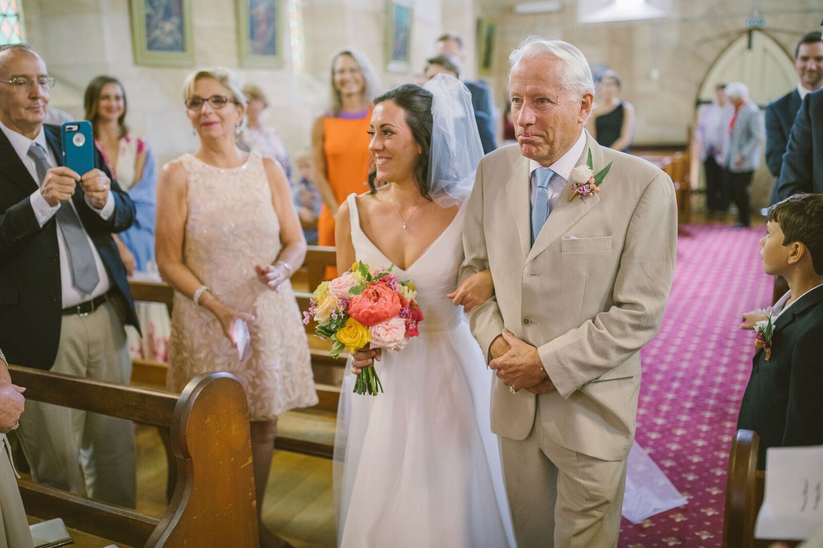 Bride and father of the bride walking down the aisle