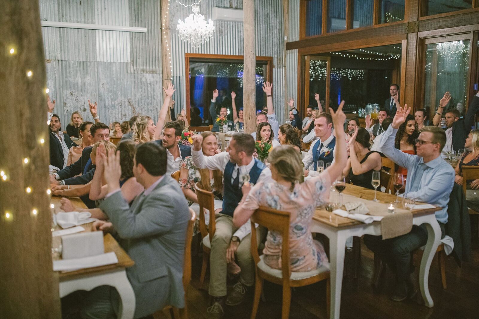 Wedding guests cheering