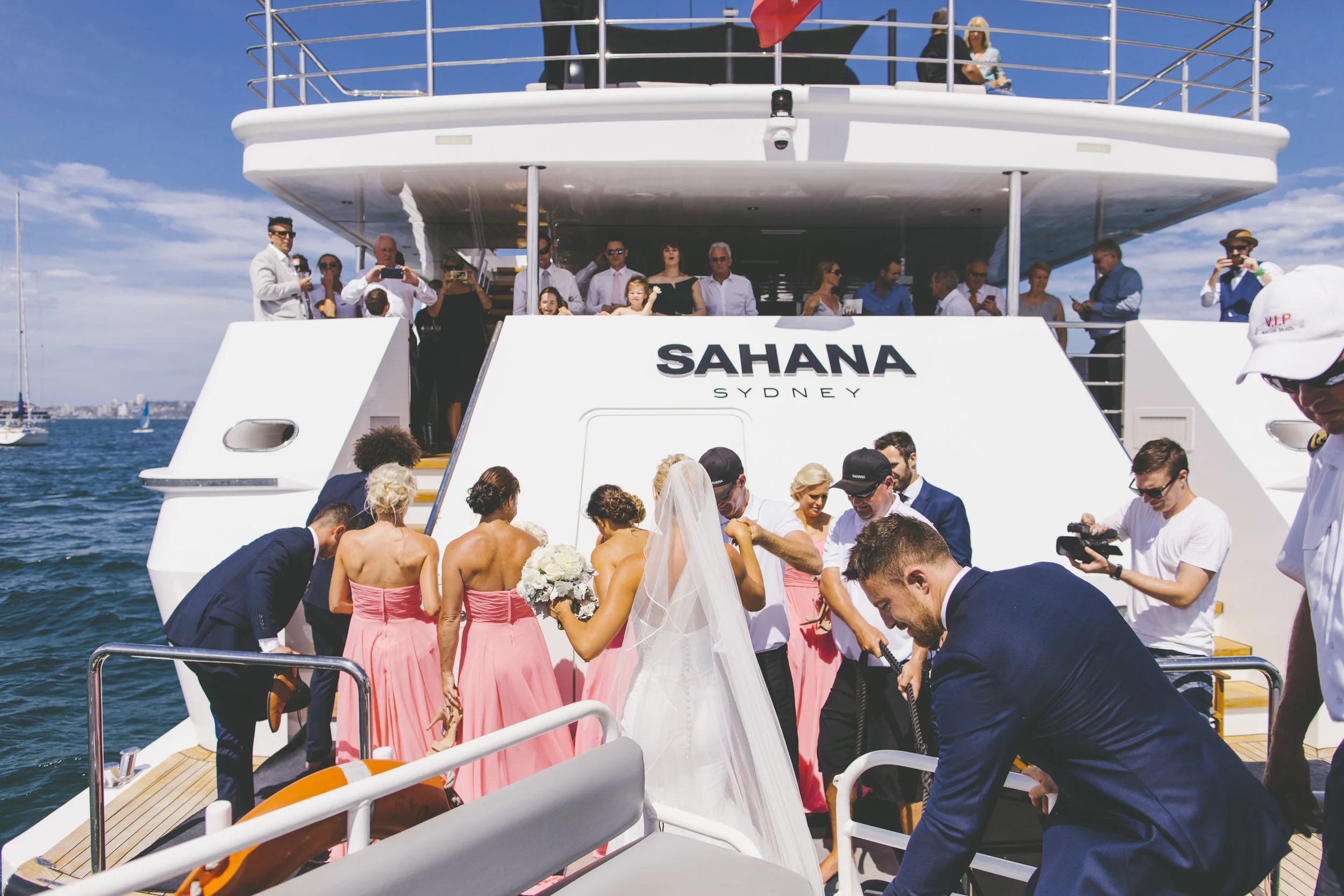 Bride and Groom getting on the boat at their wedding reception