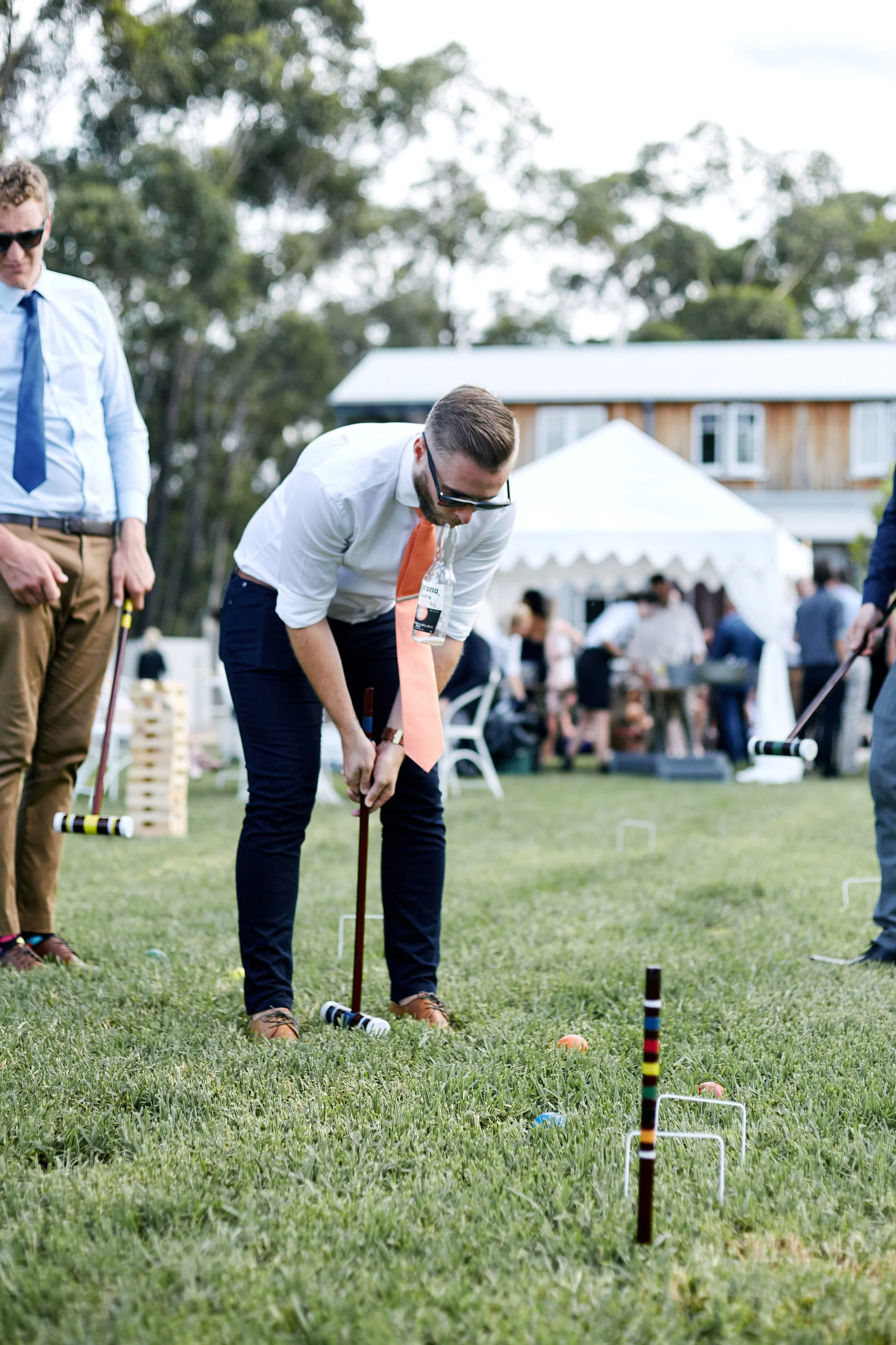 Wedding guest playing croquet