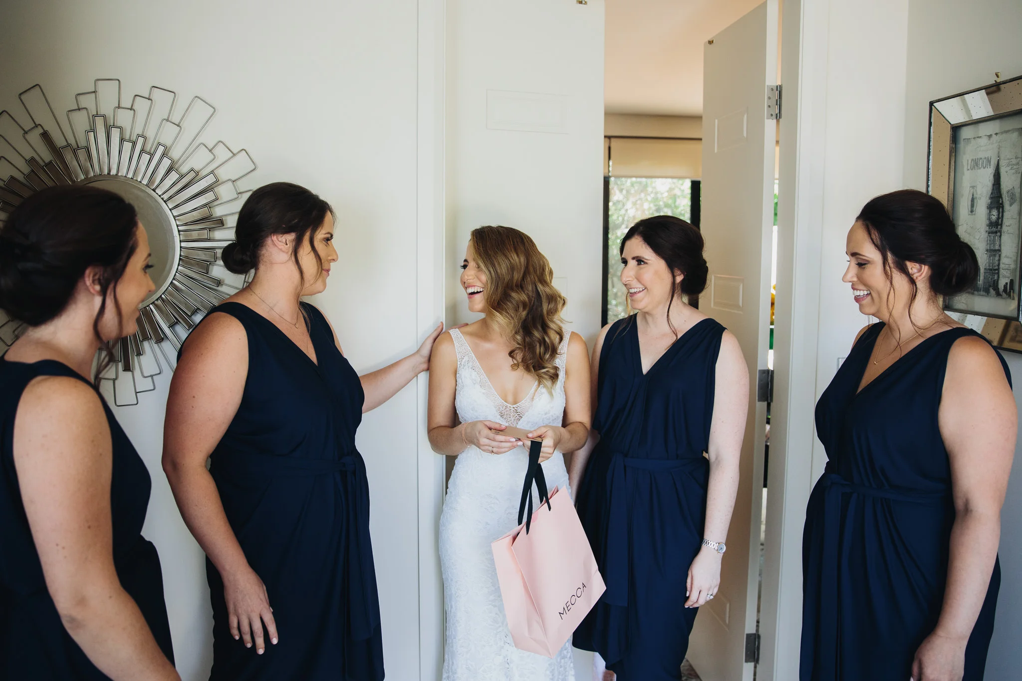 Bride and bridesmaids getting ready before the wedding