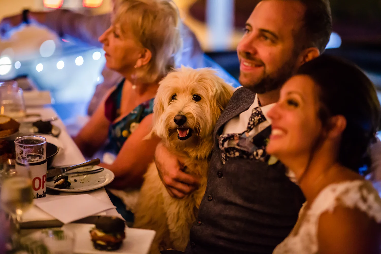 BRIDE AND GROOM WITH THEIR DOG AT THEIR SYDNEY WEDDING IN BONDI BEACH WITH THEIR SYDNEY WEDDING PLANNER