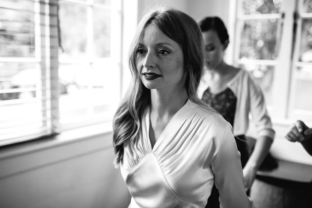 Bride getting ready for wedding in boho vintage wedding dress