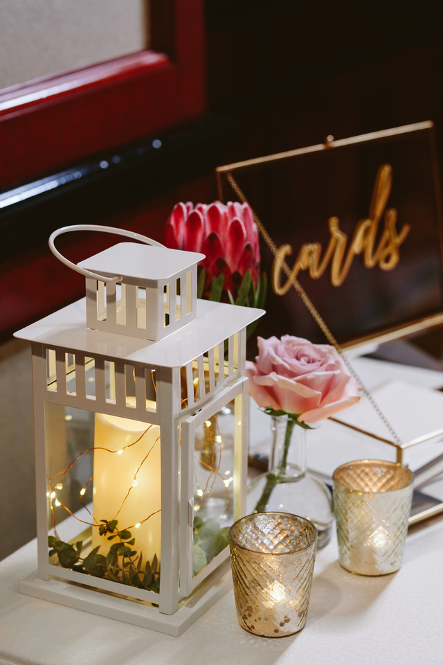 Wedding decorations for a wedding at The Shangri-La Sydney. White lanterns with fairy lights and cold candles.