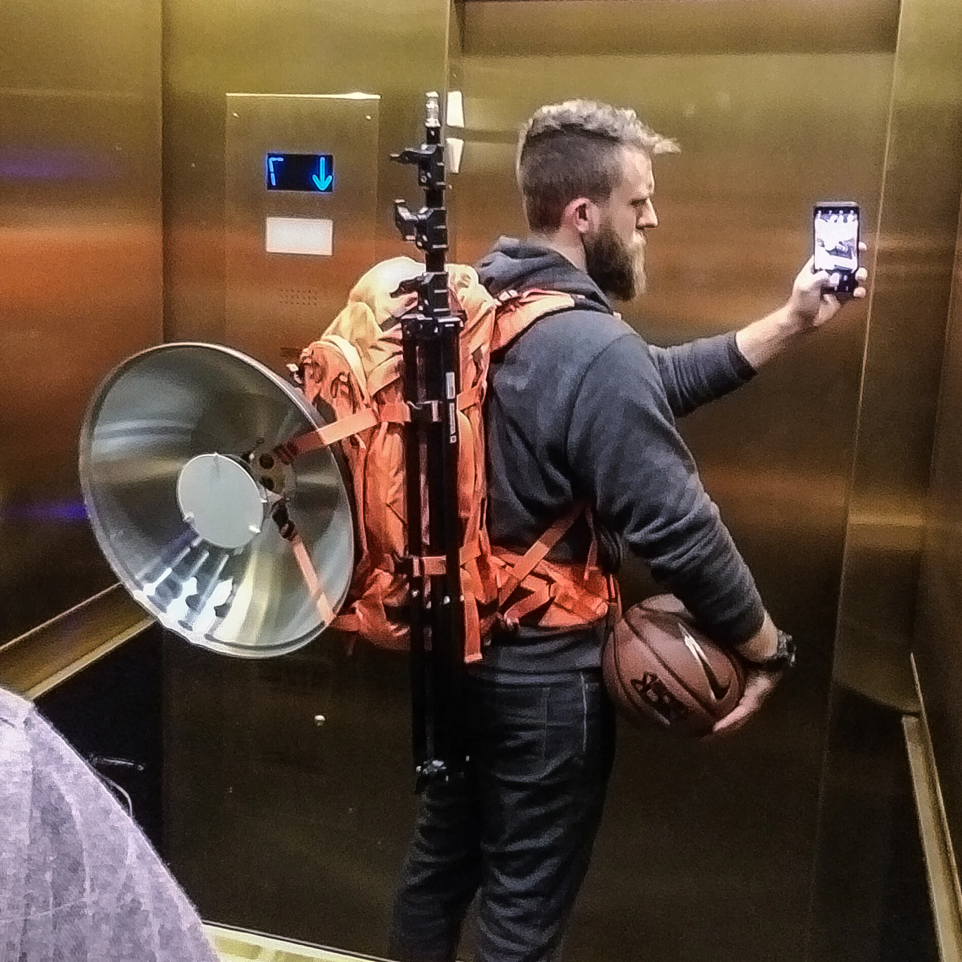 Carrying: two camera bodies, 4 lenses, 1 Profoto B1, 3x B1 batteries, light stand, 21" beauty dish in an f-stop Gear Tilopa pack. And a basketball. 