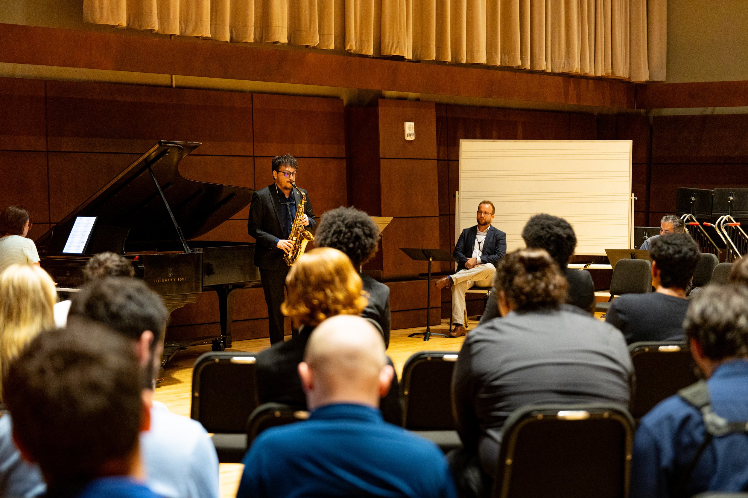 Braden Stephen performing in a masterclass for Cimarron Quartet