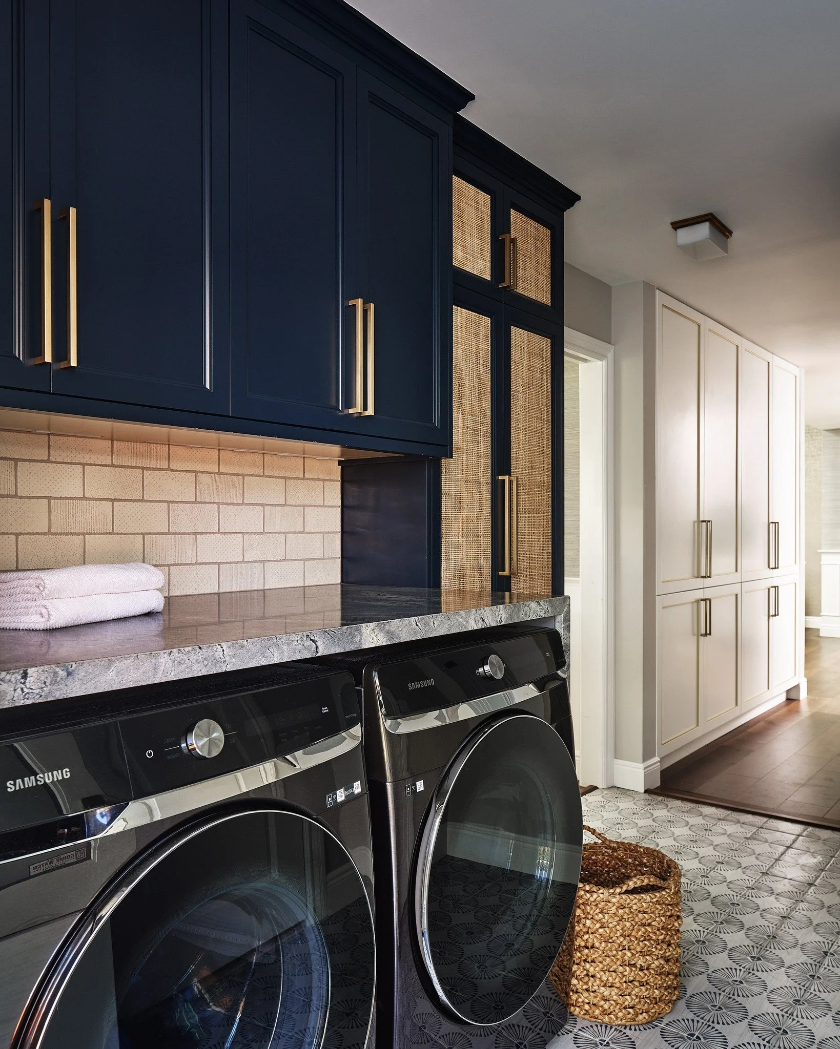 Before and after. Workhorse spaces can be beautiful as well as functional. The closets are an elegant way to hide space for each family member. The roll out shelves include for charging laptops, while the upper cabinets have hooks for backpacks and c