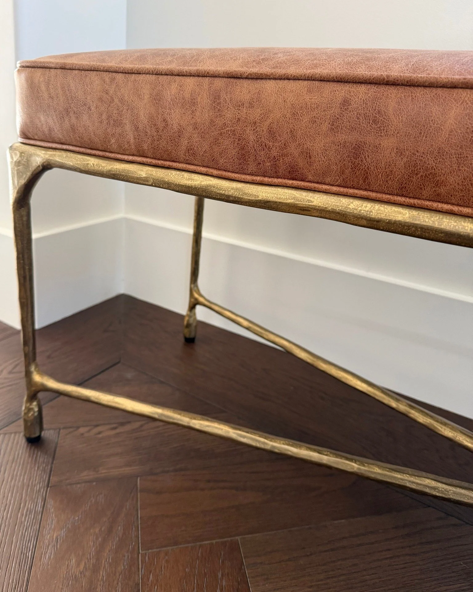 This leather and iron bench sets off the beautiful Chevron wood floor. 

@madegoods 
#janamagginetti