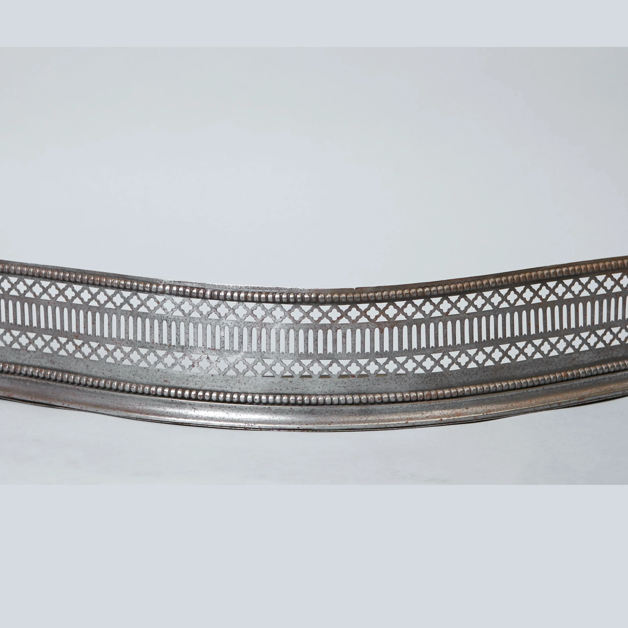A late 18th century English pierced steel fender