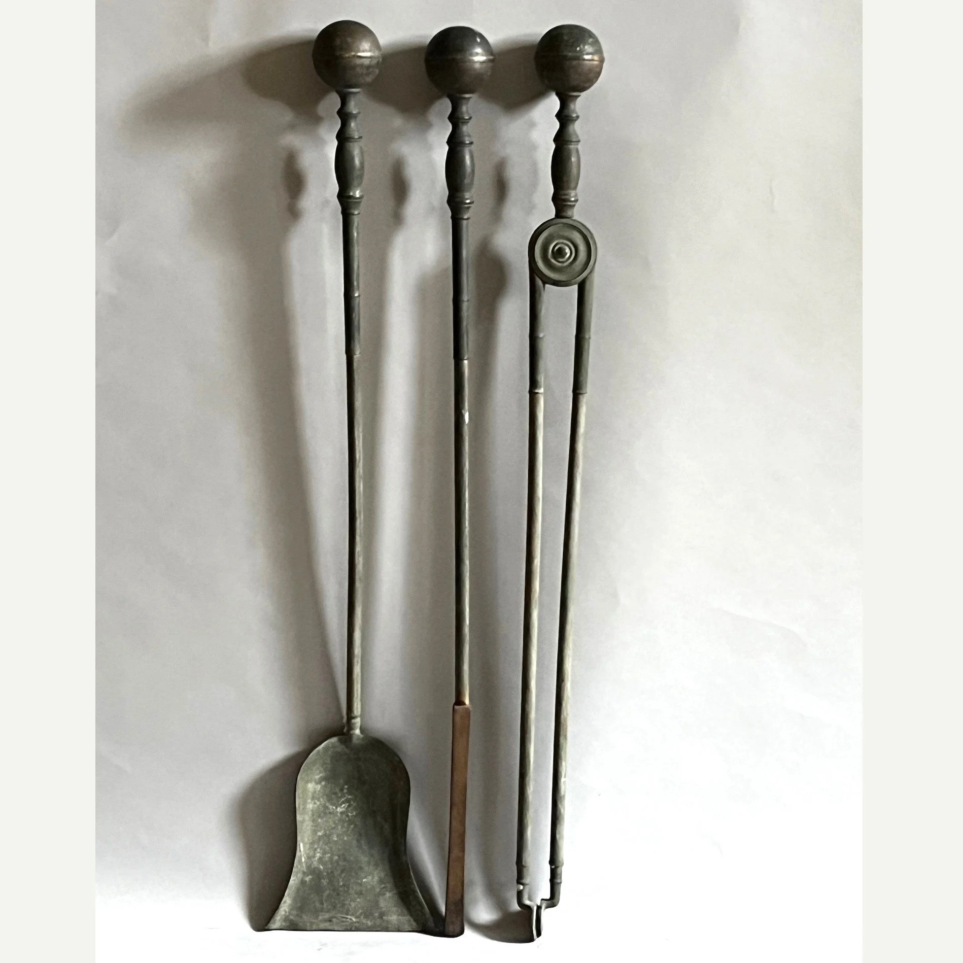A huge set of early 20thc brass and iron firetools, possibly American