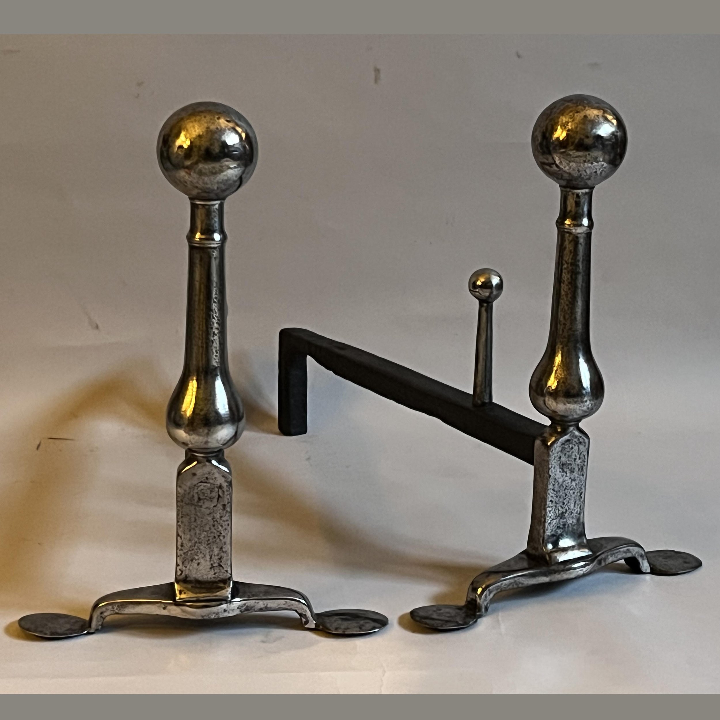 A pair of late 19th century English wrought iron andirons
