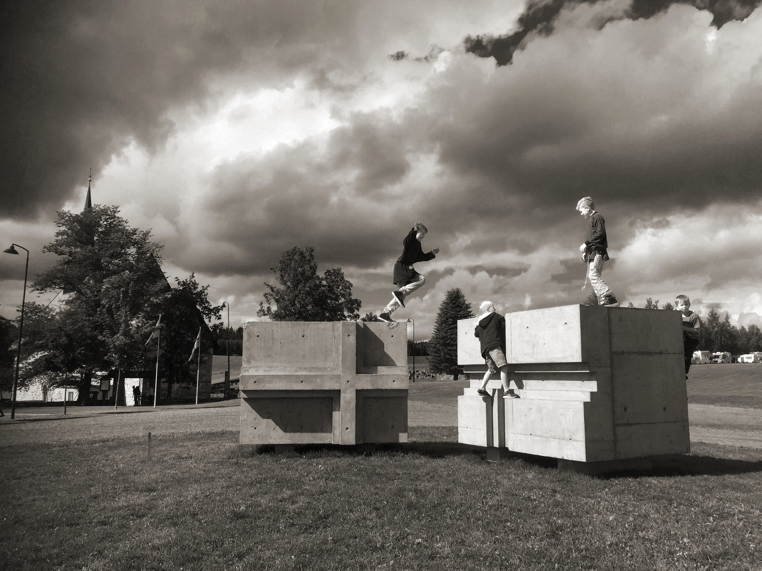 STIKLESTAD NATIONAL CULTURAL CENTER / JULY 2015: PER FRONTH / OLSOK KUNSTNER / OLSOK ARTIST In 2015 Per Fronth was given the honour of being selected Olsok Kunstner at Stiklestad National Cultural Centre. Stiklestad is of great historic importance in Norway; it is the battlefield where King Olaf Haraldsson II. died on July 29th 1030. He was later sanctified as St. Olav by the Pope and the Catholic church. Norwegian Crown Prince Haakon Magnus was chosen to be Olsok Profile same year as Fronth was Olsok Artist. King Olaf or St. Olav is widely known to have been the King who christened Norway. The Norwegian flag carry a cross as its main symbol. Every Year Norwegians celebrate Olsok on July 29th. Pictured is Per Fronth 15 ton concrete Flag sculpture " ED " installed on the battlefield - in front of the church built on the rock where King Olaf is said to have taken his terminal breath.