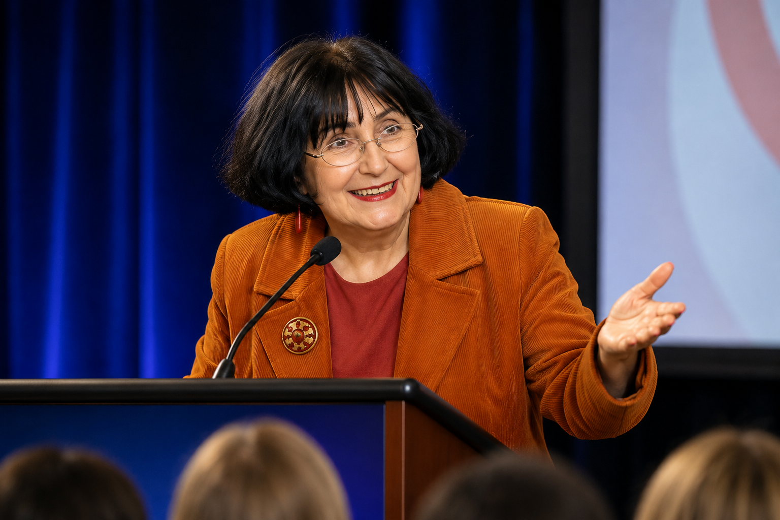 Anita Manning TV auctioneer and after dinner speaker celebrity on stage