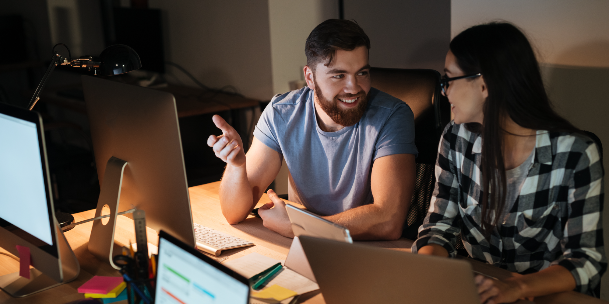 2000x1000-graphicstock-photo-of-happy-business-people-working-late-at-night-in-their-office-with-laptops-and-computers_HI-Ll_md2l.png