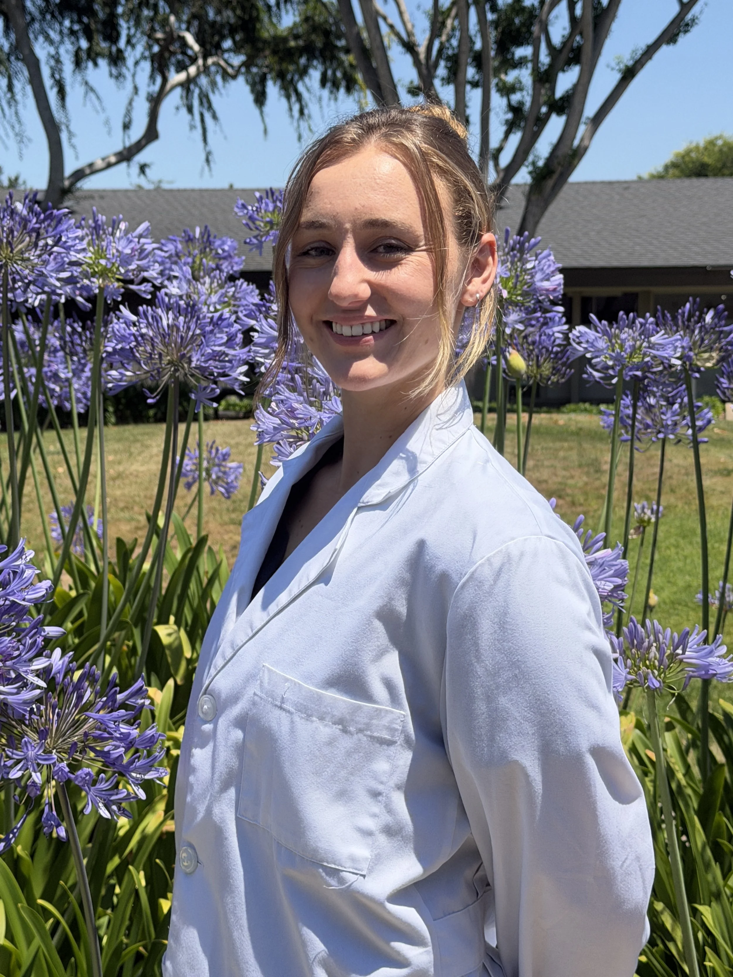 Dr. Terra Headshot Flowers