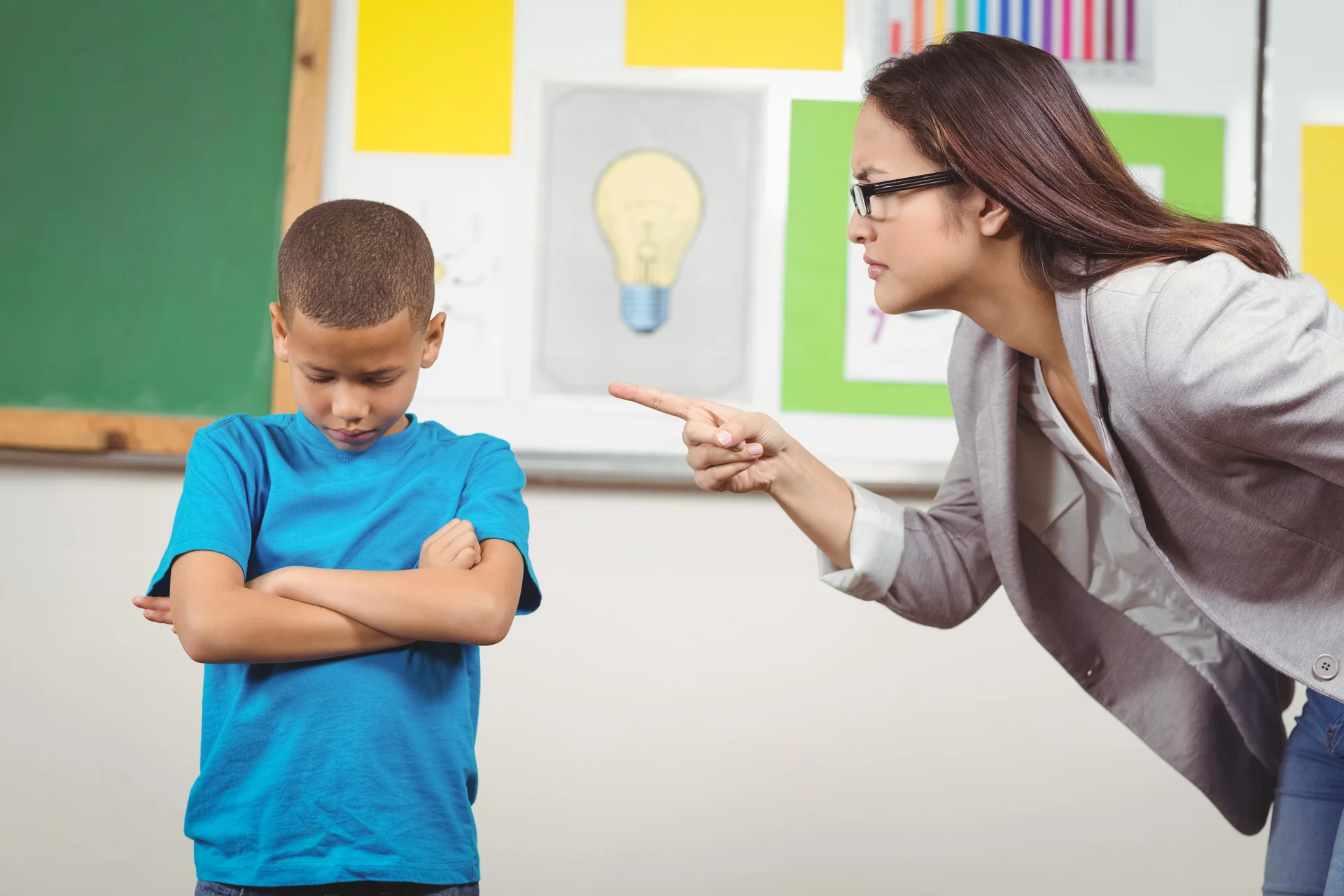 Teacher scolding child.