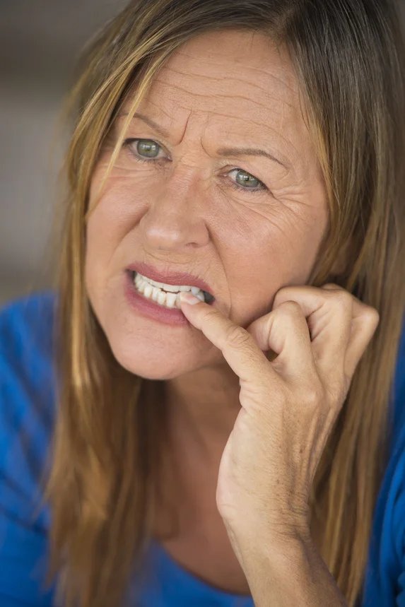 052354845-stressed-woman-biting-nervous-.jpeg