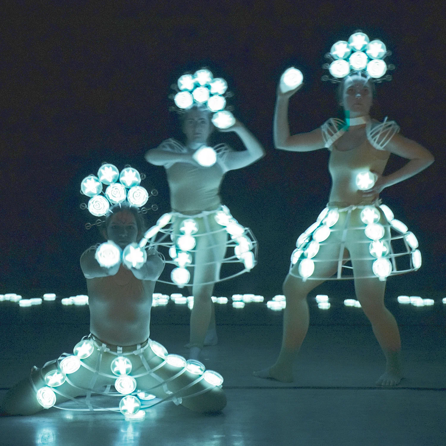 “Dancing Trio,” photograph by the light of bioluminescent bacteria, Hunter Cole.