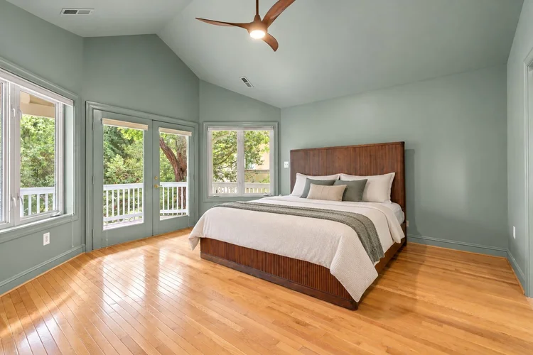 Primary Bedroom Renovation Primary bedroom renovation with sage green walls, vaulted ceiling and hardwood floors