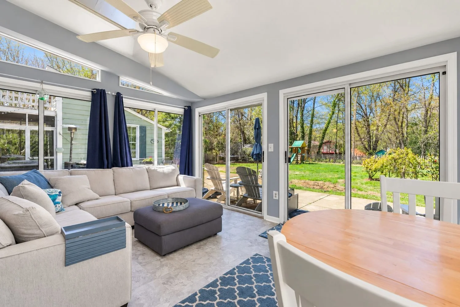 Sunroom and Family Room Renovation Sunroom and family room renovation in Maryland with vaulted ceiling, sliding doors and backyard views