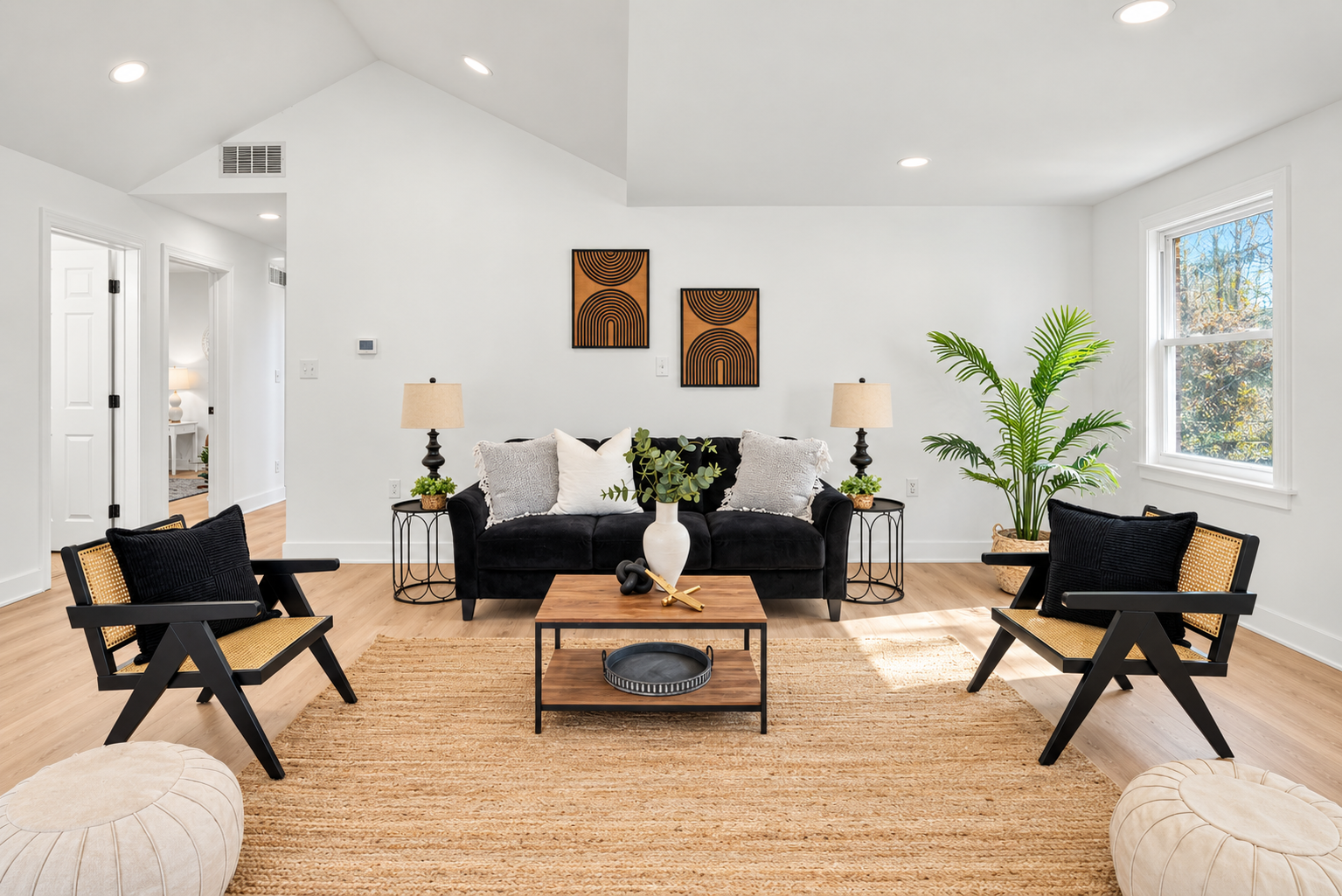 Finished living area renovation with vaulted ceiling and hardwood floors