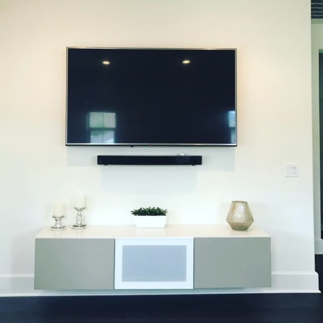 Here we hung the TV, Sound-bar and floating cabinet.