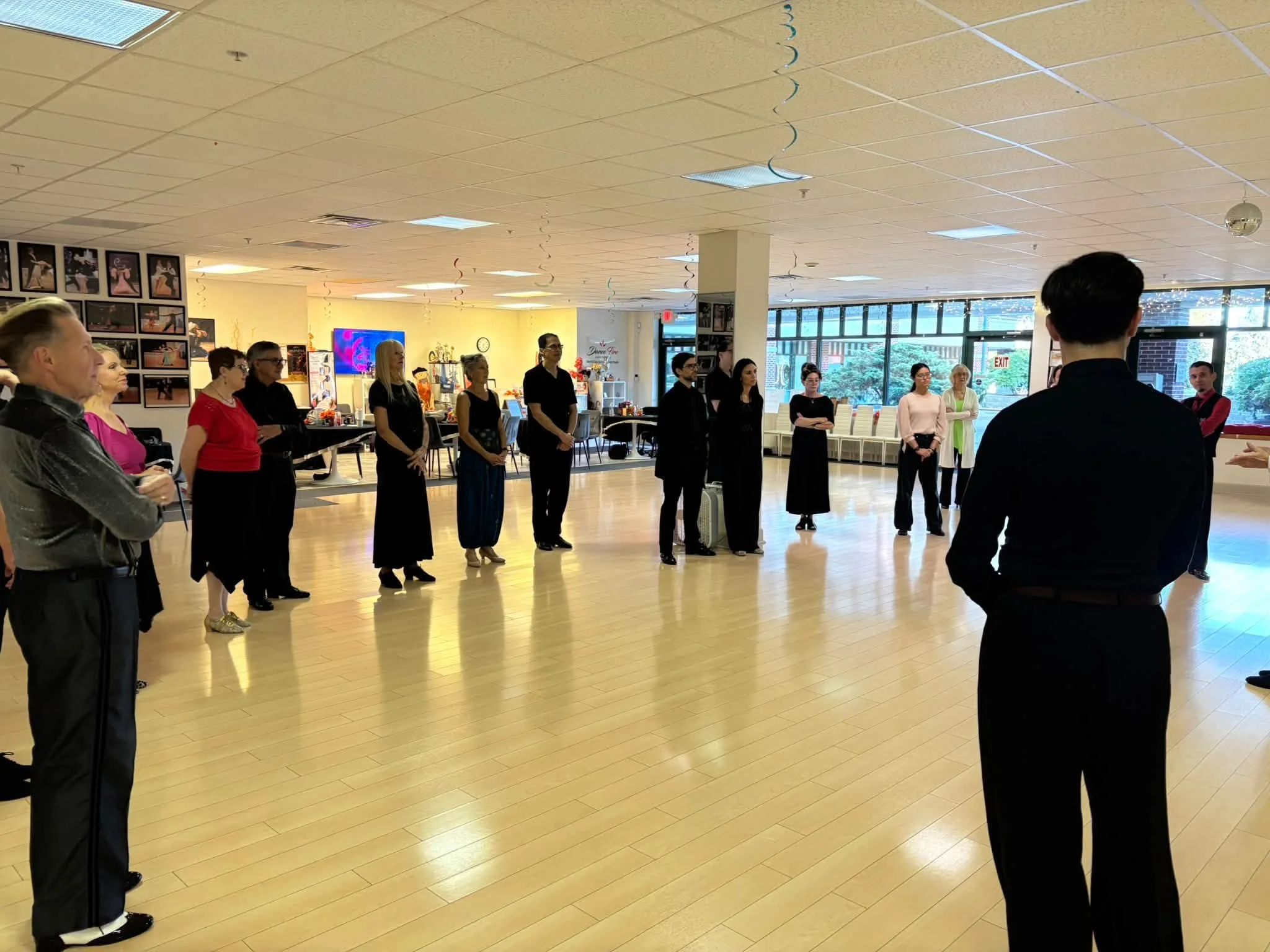 Dancers listen to group instruction during Edward Simon’s master class
